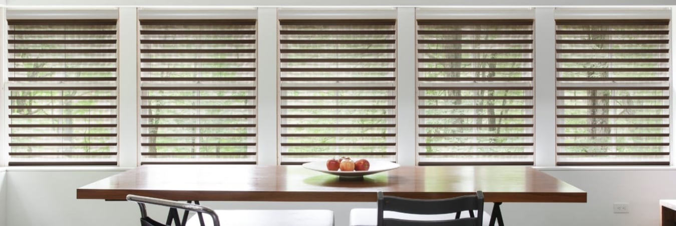 Chocolate sheer shades in a dining room